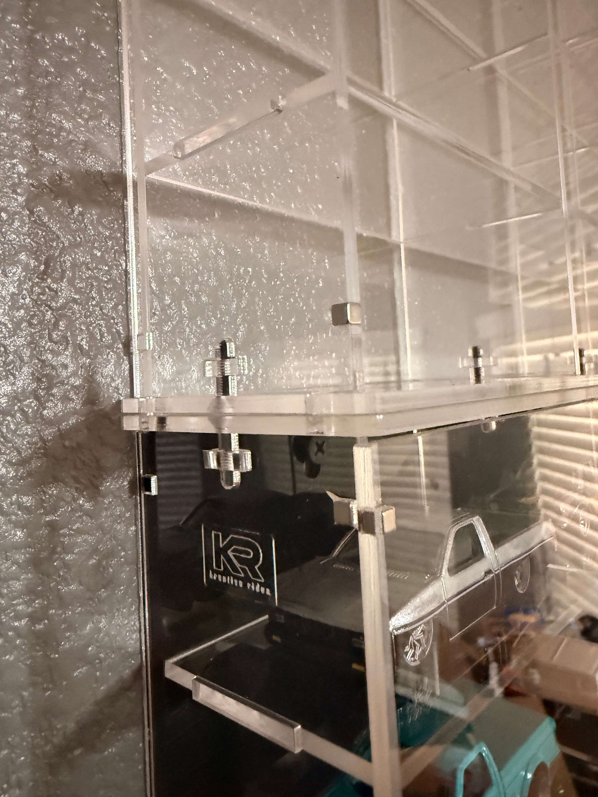 THE TWENTY PACK - Acrylic display case with a clear or black background that holds up to 20 individual 1:64 scale model vehicles