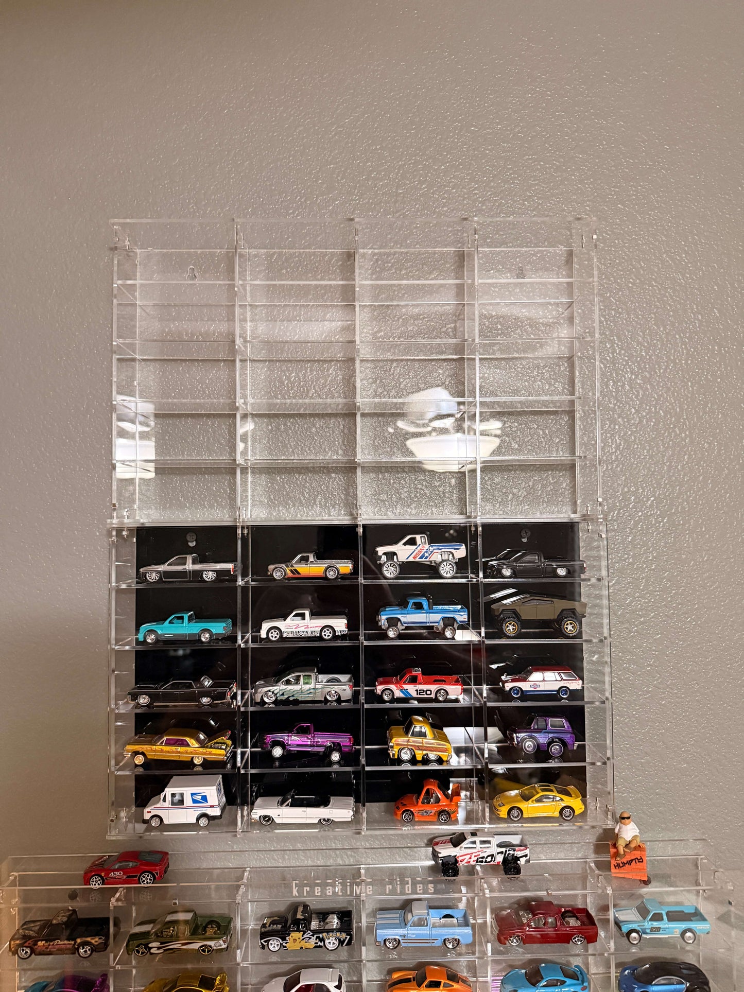 THE TWENTY PACK - Acrylic display case with a clear or black background that holds up to 20 individual 1:64 scale model vehicles