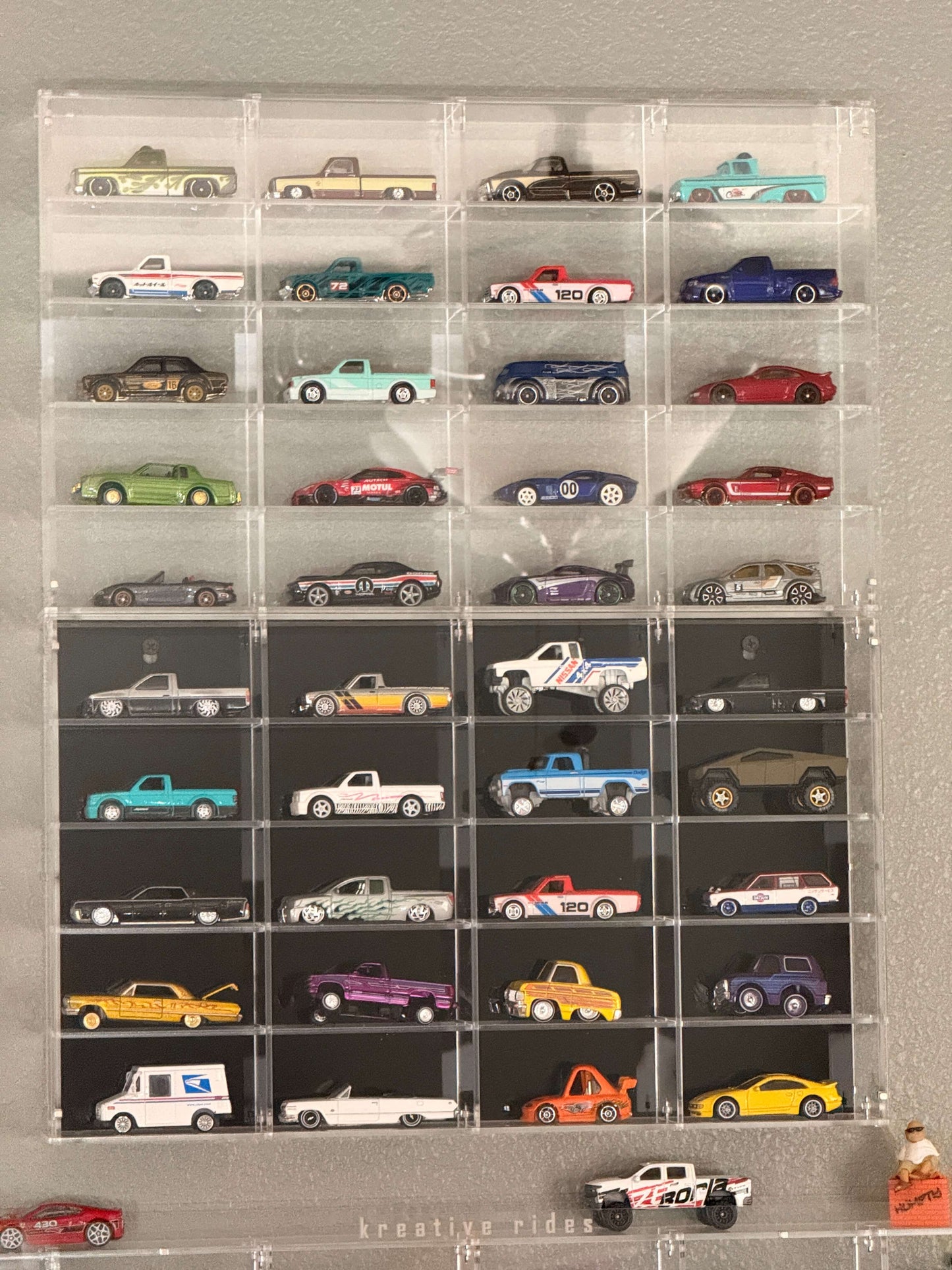 THE TWENTY PACK - Acrylic display case with a clear or black background that holds up to 20 individual 1:64 scale model vehicles