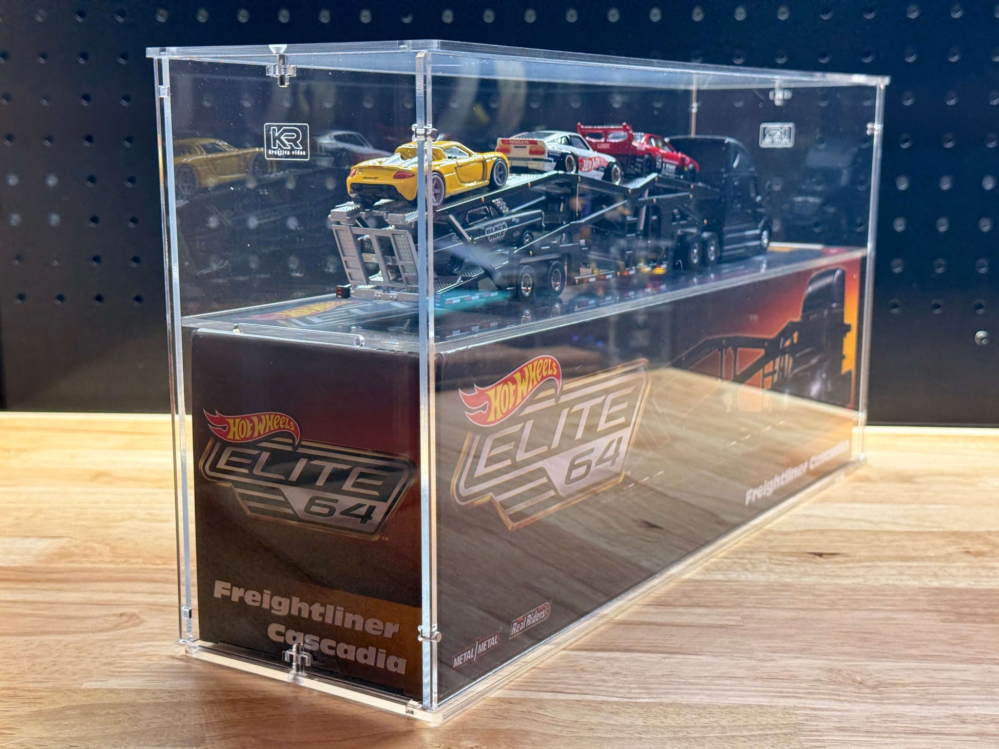 Hot Wheels Elite 64 Freightliner Cascadia in an acrylic display case