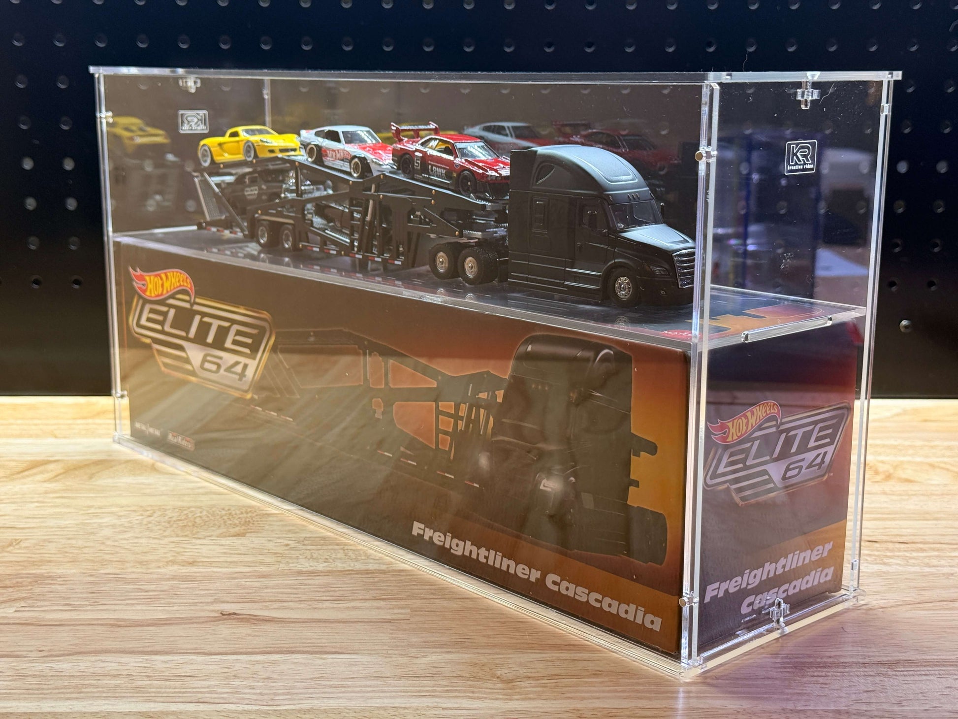 Hot Wheels Elite 64 Freightliner Cascadia in an acrylic display case